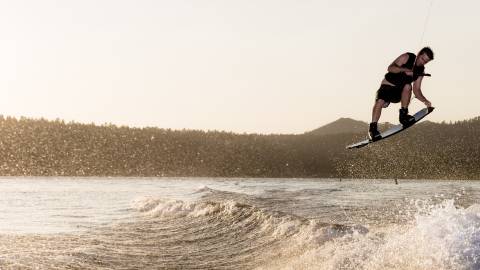 A wakeboarder catches air on a Big Bear Lake wave