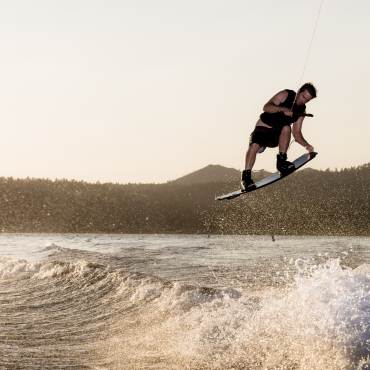 A wakeboarder catches air on a Big Bear Lake wave