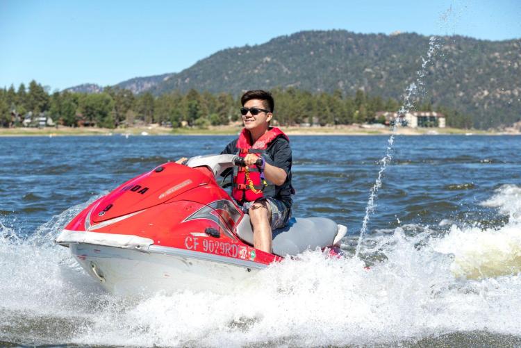 A man on a jet ski enjoying a sunny summer day on Big Bear Lake