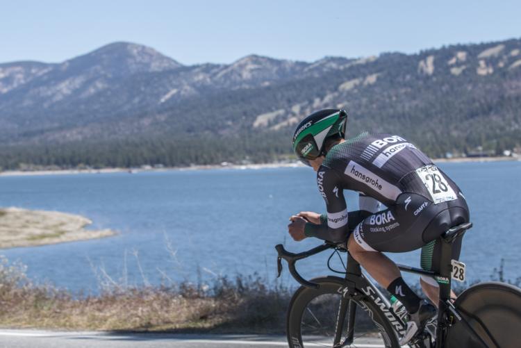 Man cycling on North Shore road near Big Bear Lake while high-altitude training