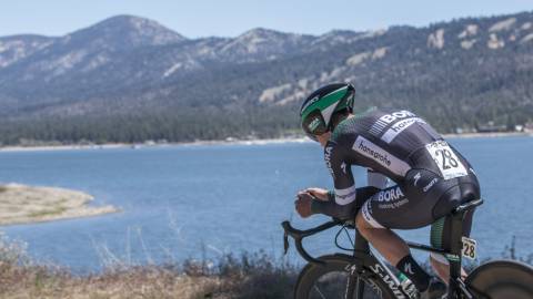Man cycling on North Shore road near Big Bear Lake while high-altitude training