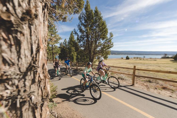 Family biking along Alpine Pedal Path