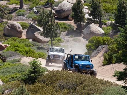 Jeeps drive along a fire road on a Spring off-roading adventure through Big Bear Lake, CA