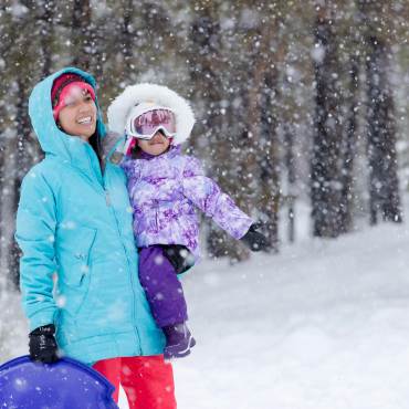 A mother and daughter in the snow in Big Bear
