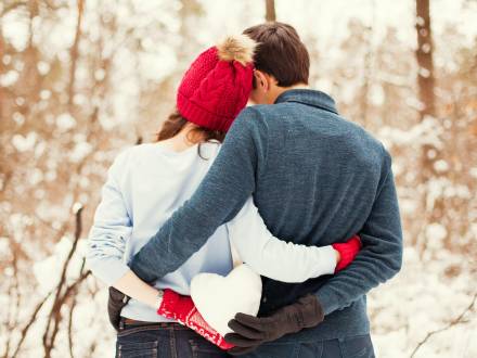 couple holds a heart snowball in Big Bear, CA