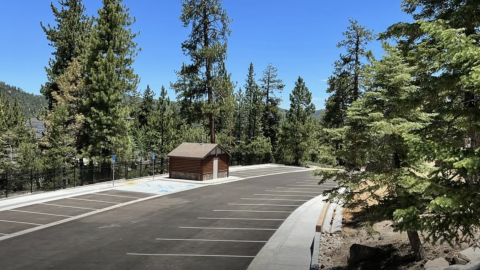 A ground level photo of the newly built Castle Rock Trailhead parking lot, there are two handicapped parking spaces.