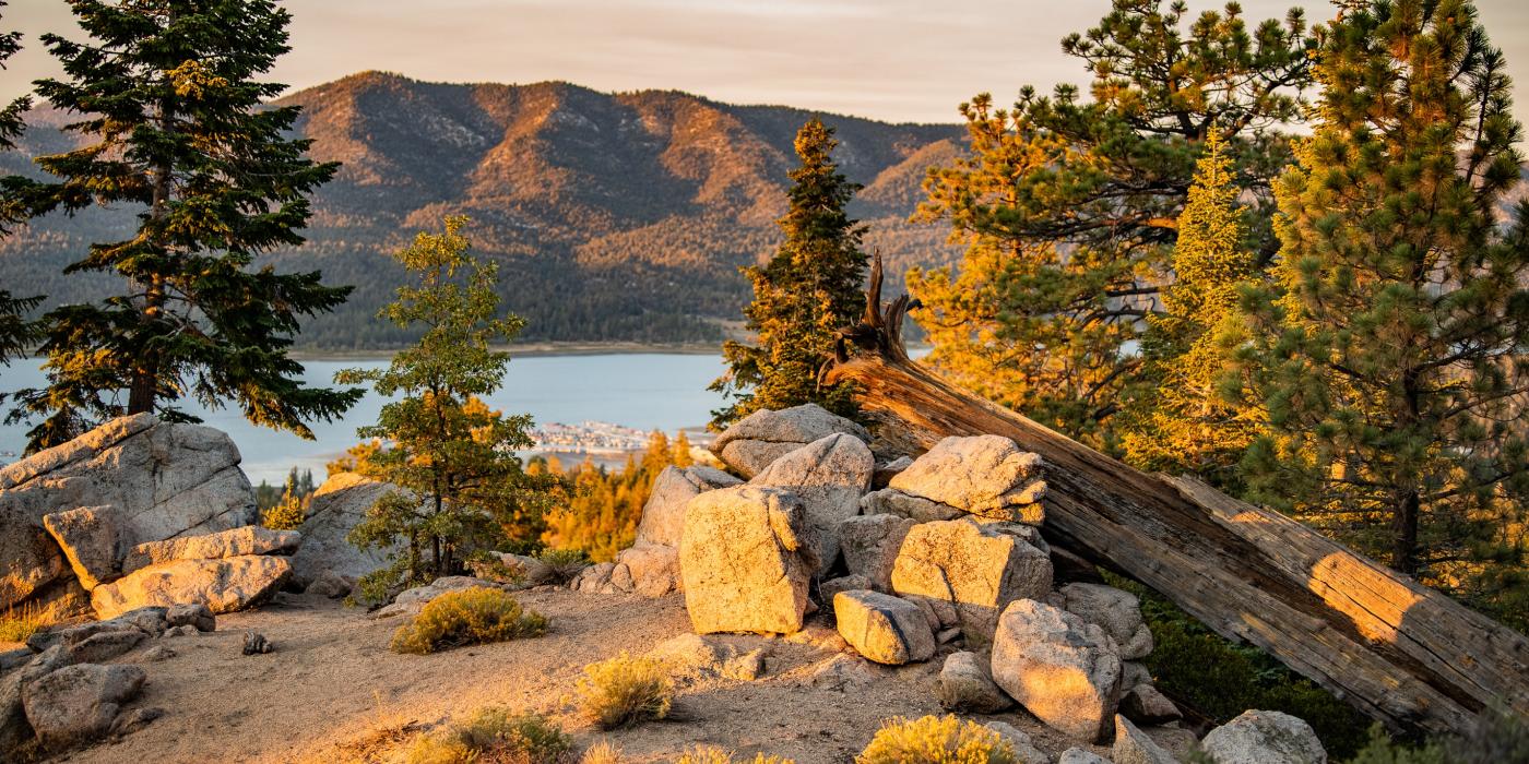Scenic view of Big Bear Lake with autumn colors and mountain backdrop