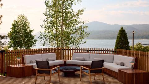 Lakeview lounge deck at Hotel Marina Riviera in Big Bear Lake with modern seating and mountain backdrop