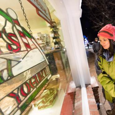 A mother holds her daughter while enjoying shopping The Village at Big Bear Lake