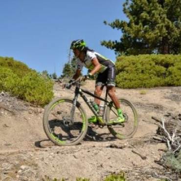 Woman riding mountain bike along Skyline Trail During Big Bear CA Gran Fondo race