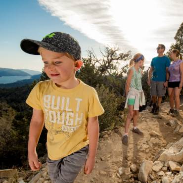 A family hikes together on a North Shore Big Bear trail