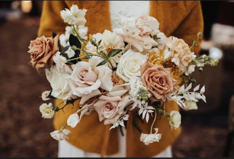 A photo of a wedding bouquet of white and pink flowers from Little Green House Florist in Big Bear Lake.