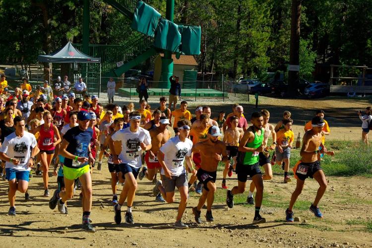 A large crowd of runners competing in the Big Bear Lake, Conquer The Wall event at Snow Summit.