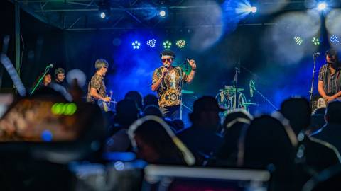 A photo taken from the Big Bear Summer Concert Series -  the band on stage is playing in front of a large crowd.
