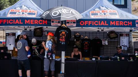 A pair of vendor booths selling official MX Grand Prix by O'NEAL merchandise to customers at Bear Mountain Resort.