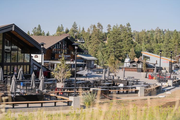 Bear Mountain Resort's Deck - there are a large amount of tables and chairs overlooking the mountains out of view.