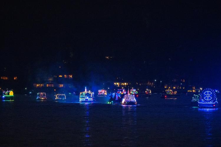 A bunch of brightly lit boat displays seen on the lake waters during the Big Bear Lake Labor Day Boat Parade.