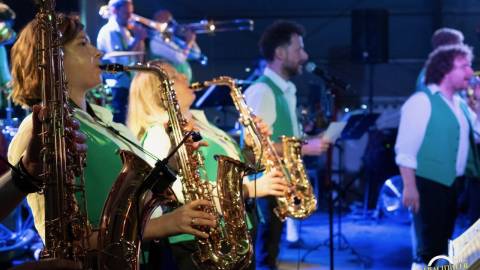 A line of musicians play saxophones in a band performance during Big Bear Oktoberfest 2024.