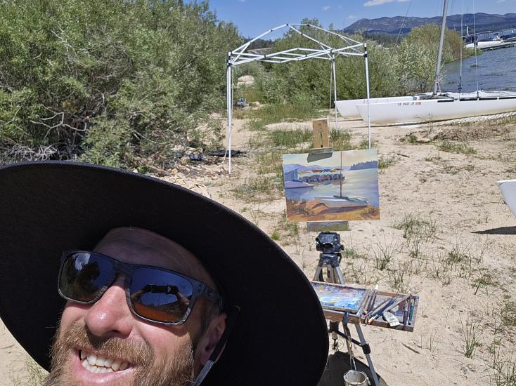 An artist's social upload of their painting during the Plein Air competition, his painting depicts the Big Bear Shoreline.