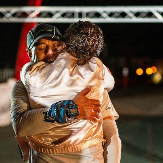 Two competitors embrace during the Kodiak Ultra Marathon in Big Bear