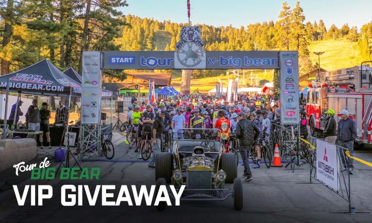 The starting line of Tour De Big Bear, cyclists are lined up into the distance waiting for the race to start.