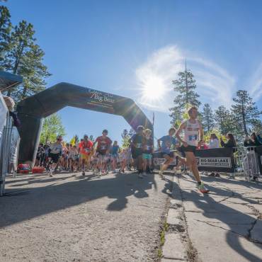 Memorial 5k ending with racers crossing the finish line