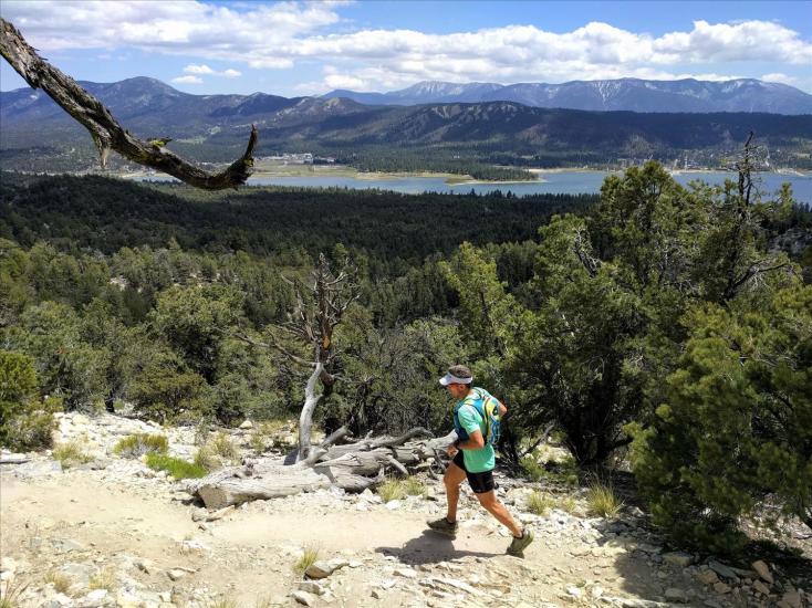 A runner runs along a trail during the Big Bear Lake Holcomb Valley Trail Run.