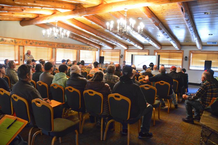 A large group of people sitting down in chairs while listening to a presentation during the Ham Escape radio event.
