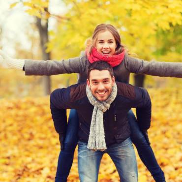 Couple enjoying the golden fall forest Big Bear Lake California.