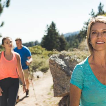 A family hikes along a trail in Big Bear Lake, California.