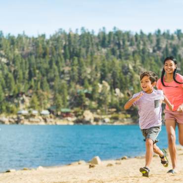 Kids running on a beach
