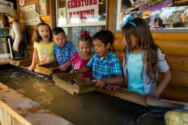 Children sift for gold at the Gold Rush Mining Co. Big Bear CA