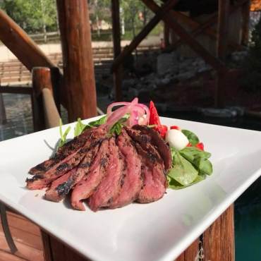 a plate of food served on a patio at a restaurant in Big Bear Lake
