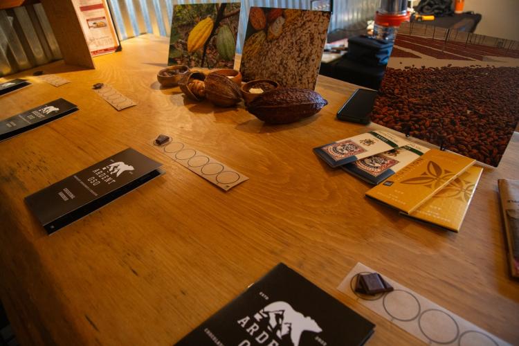 A photo taken at Barrel 33 during the Ardent Oso Chocolate Experience. There are cacao chocolate pods on the table.