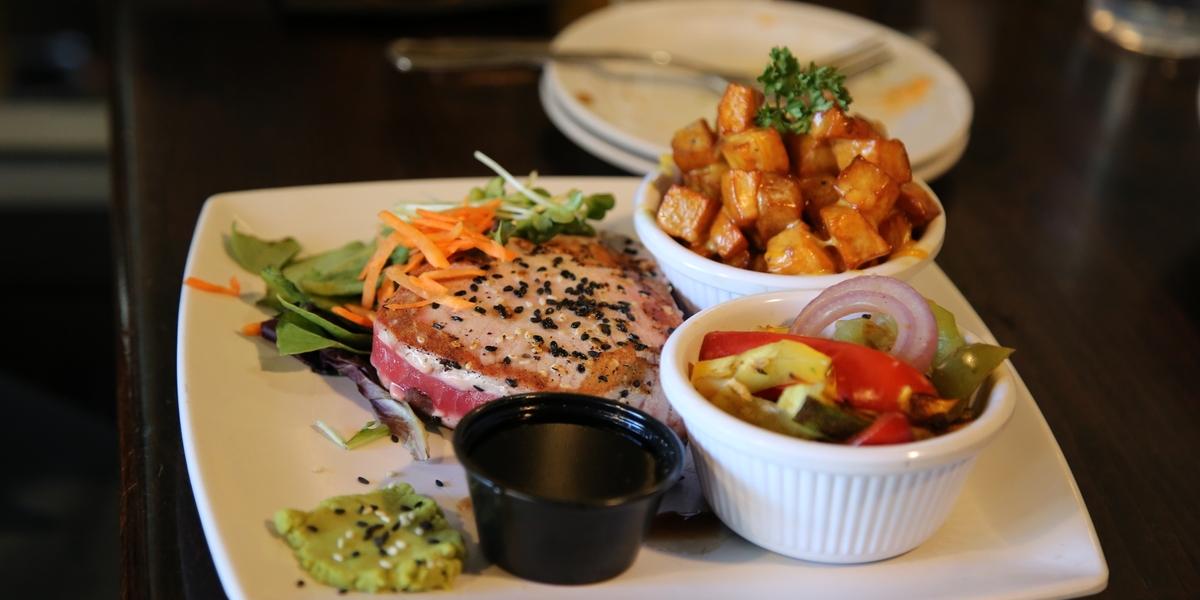 A photo of Big Bear Lake Brewing Company's Seared Ahi Tuna Steak, there some Wasabi off to the side.