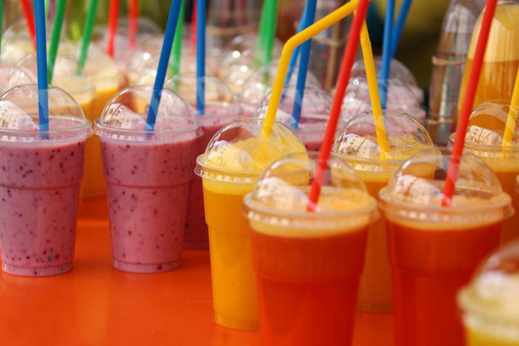 A collection of red, yellow, and purple fruit smoothies sit on a countertop at Amangela's Sandwich & Bagel House in Big Bear.
