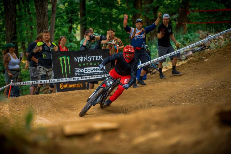 A picture of a bike rider during the Monster Energy Pro Downhill event at Snow Summit in Big Bear Lake California.