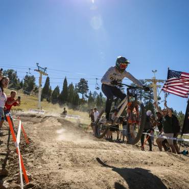 A photo from the Monster Energy Pro-Downhill event at Snow Summit, the crowd is cheering enthusiastically.