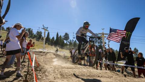 A photo from the Monster Energy Pro-Downhill event at Snow Summit, the crowd is cheering enthusiastically.