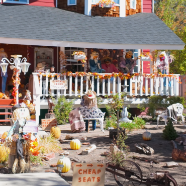 A photo from the Big Bear Lake Scarecrow decorating competition, a band of scarecrows are seen playing instruments on a porch