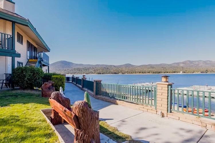A path in front of Lagonita Lodge overlooking the lake and mountains - there is clear blue skies and the solar observatory.
